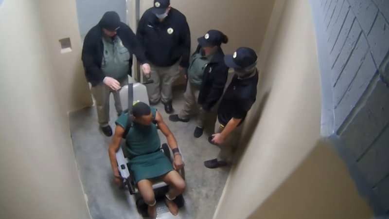 Lawsuit says video exhibits 3 jailers watch as officer wrapped chain round detainee’s neck and briefly choked him